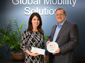 Lisa Notaro of St. Mary's Food Bank presents the Hunger Hero award to Steven Wester, President of Global Mobility Solutions.