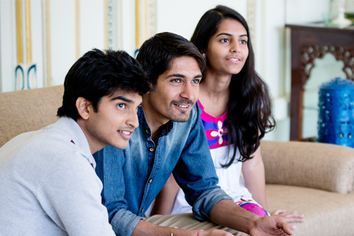 Three young Indian businesspeople working together and having fun while doing it, India e-Services Online Portal Launched by Bureau of Immigration, Government of India