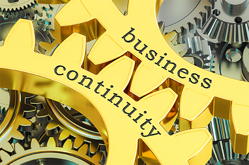 Yellow gears interlocking with the words business continuity plan