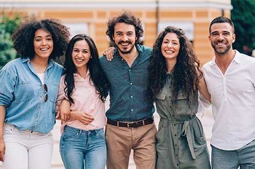 Group of five friends, all facing forward, smiling, three women and two men, who all overcame transferee moving challenges