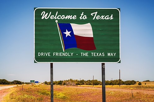 Welcome to Texas sign on roadside at state border to greet those who are moving to the state for a Texas relocation