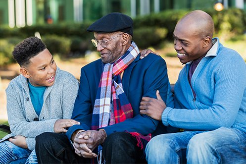 Three generations in family, grandson, grandfather, and son, all benefitted from special needs relocation services that helped find resources for elder care