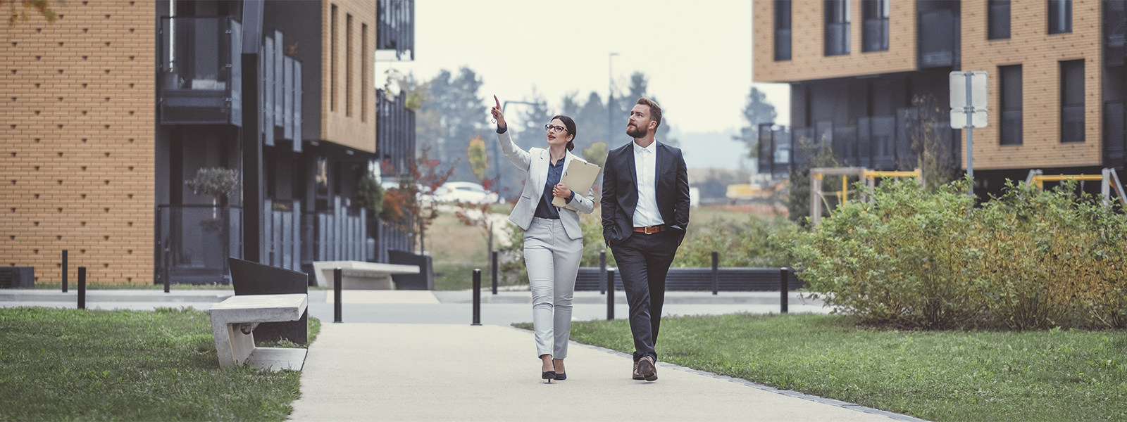 real estate agent showing a client homes on a house-hunting trip.