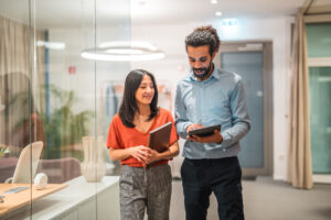 young corporate employees work together in casual business setting.