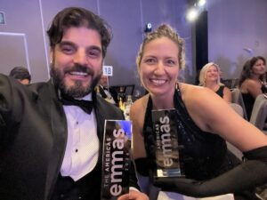 Alison and Michael holding awards