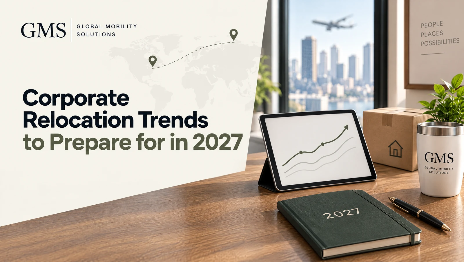 Tablet showing a trend line chart beside a 2027 notebook, pen and small moving box