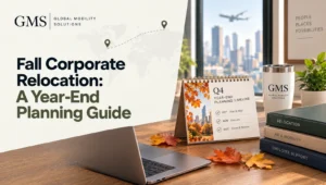 Q4 year-end planning timeline calendar with autumn leaves, laptop and relocation folders on an HR desk