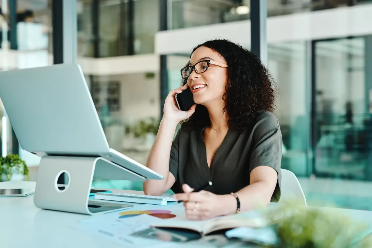 smiling african-american woman employee, happy while working