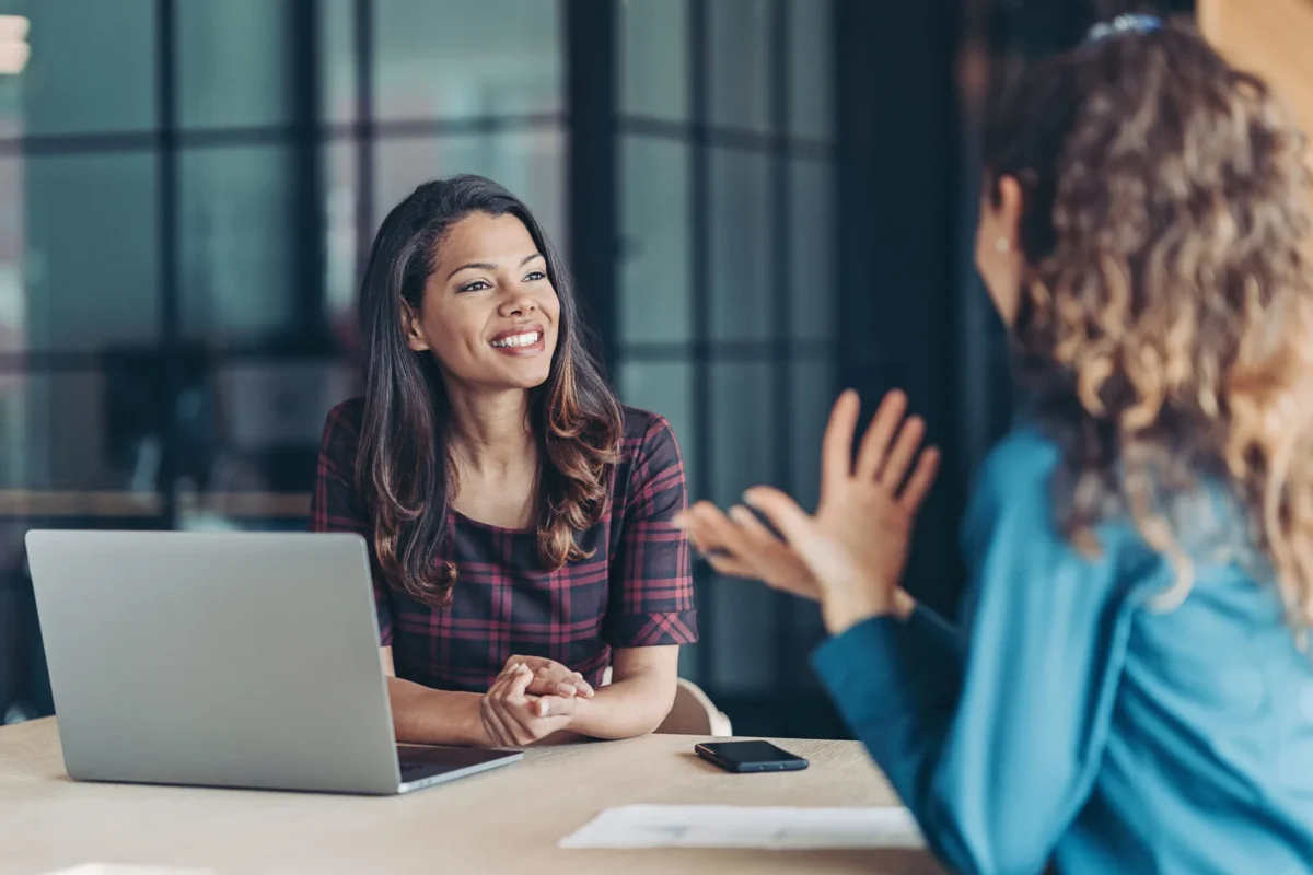 young businesswoman going over relocation package with employee