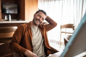 gen x man relaxing in his office after moving to a new city