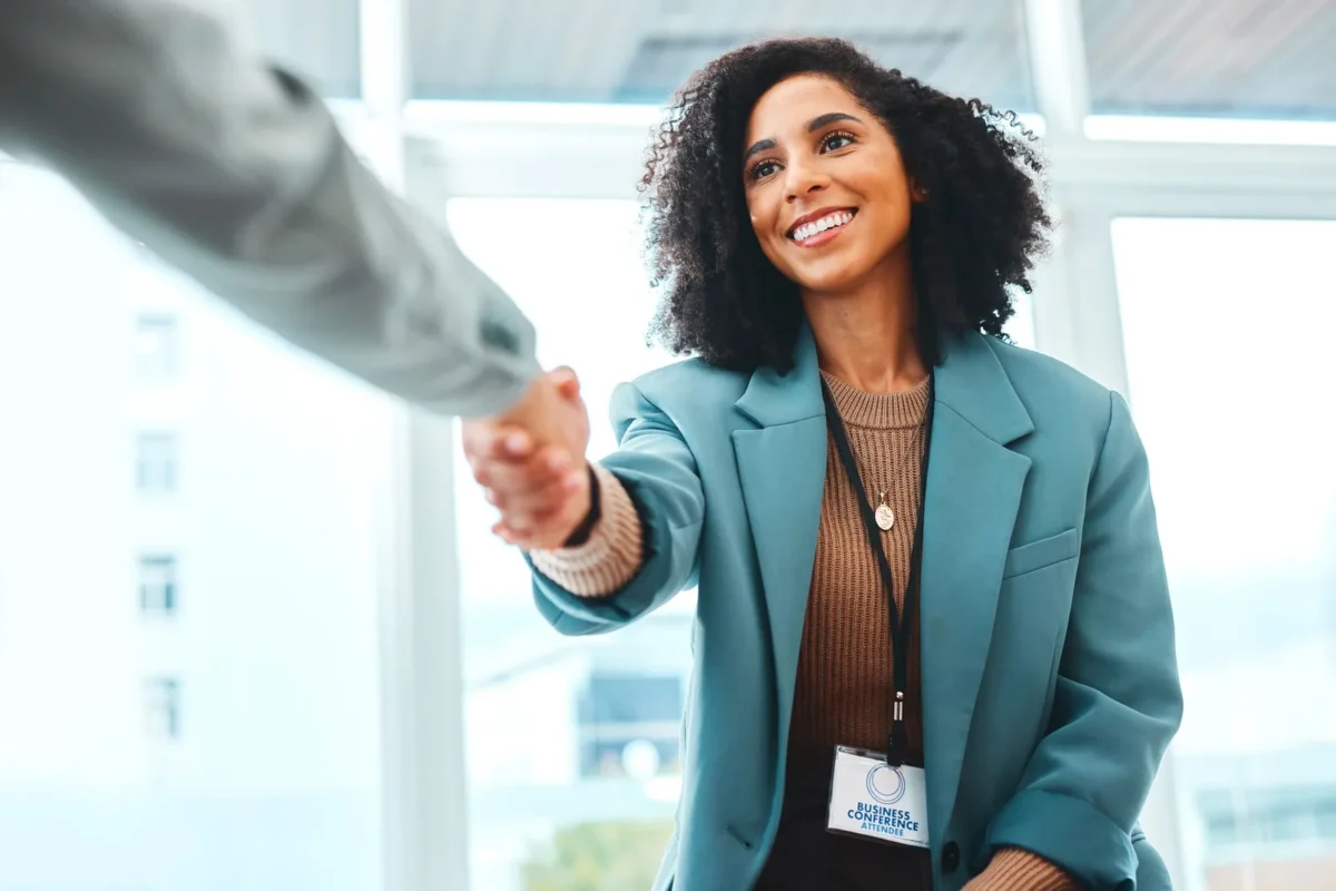 pretty African American female shaking hands with her new boss