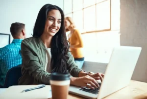 young businesswoman typing on laptop