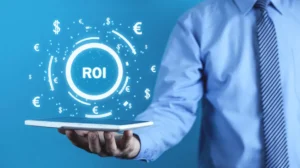 man holding computer with ROI letters and currency signs