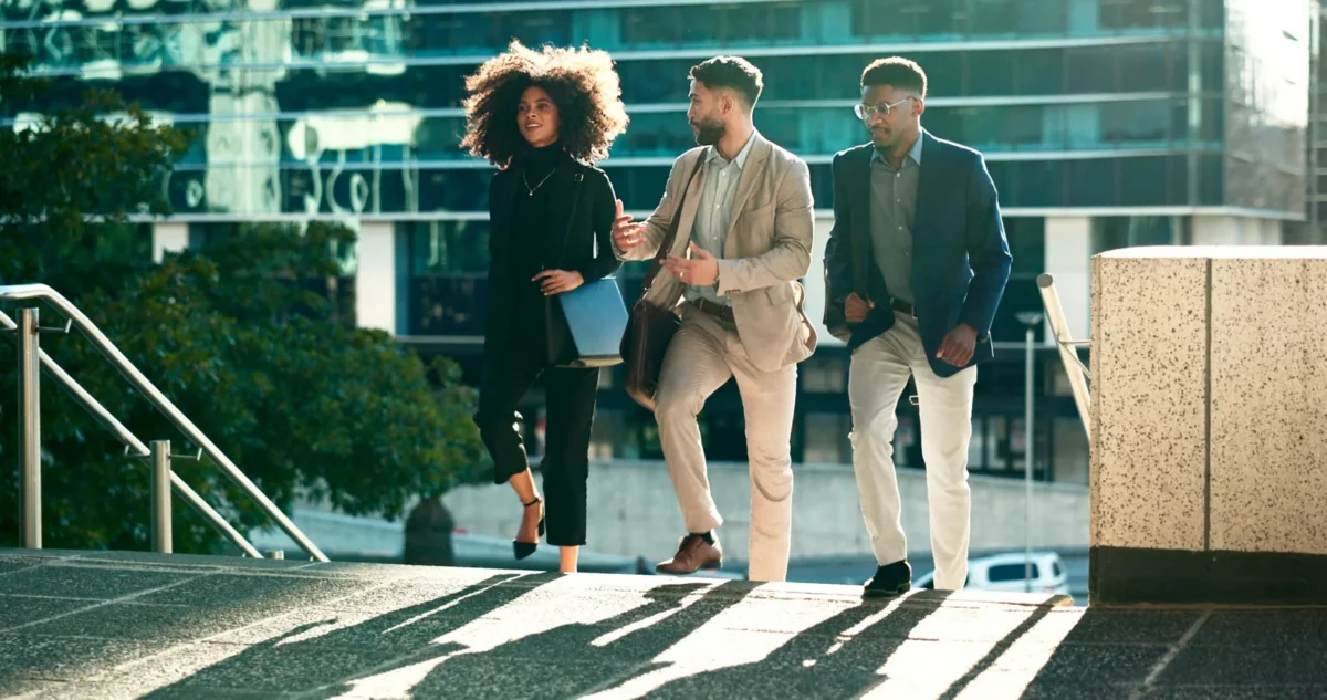 Casually dressed business team smiling and talking