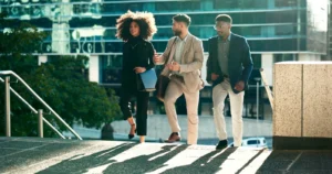 Casually dressed business team smiling and talking