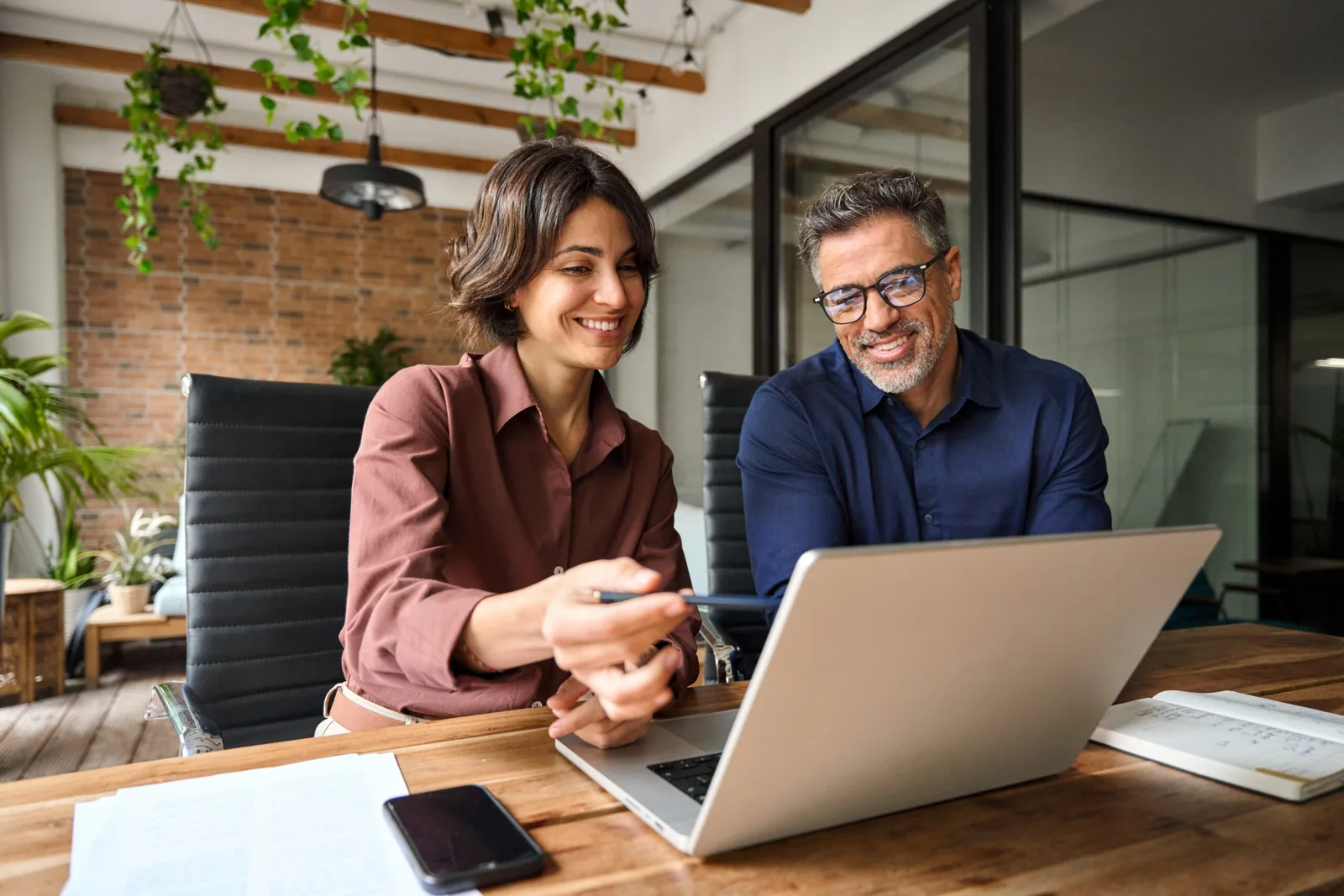 Female tax expert helping man with his taxes.